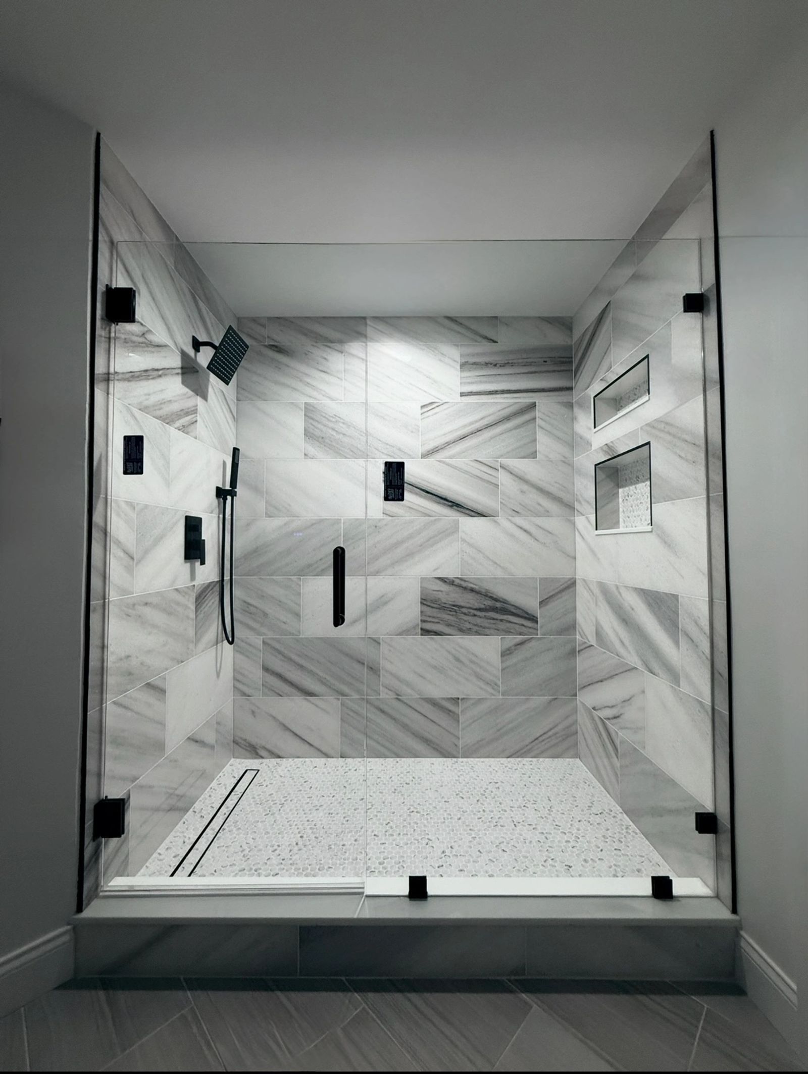 Renovated spa-inspired bathroom with marble shower on Harbour Island, Tampa